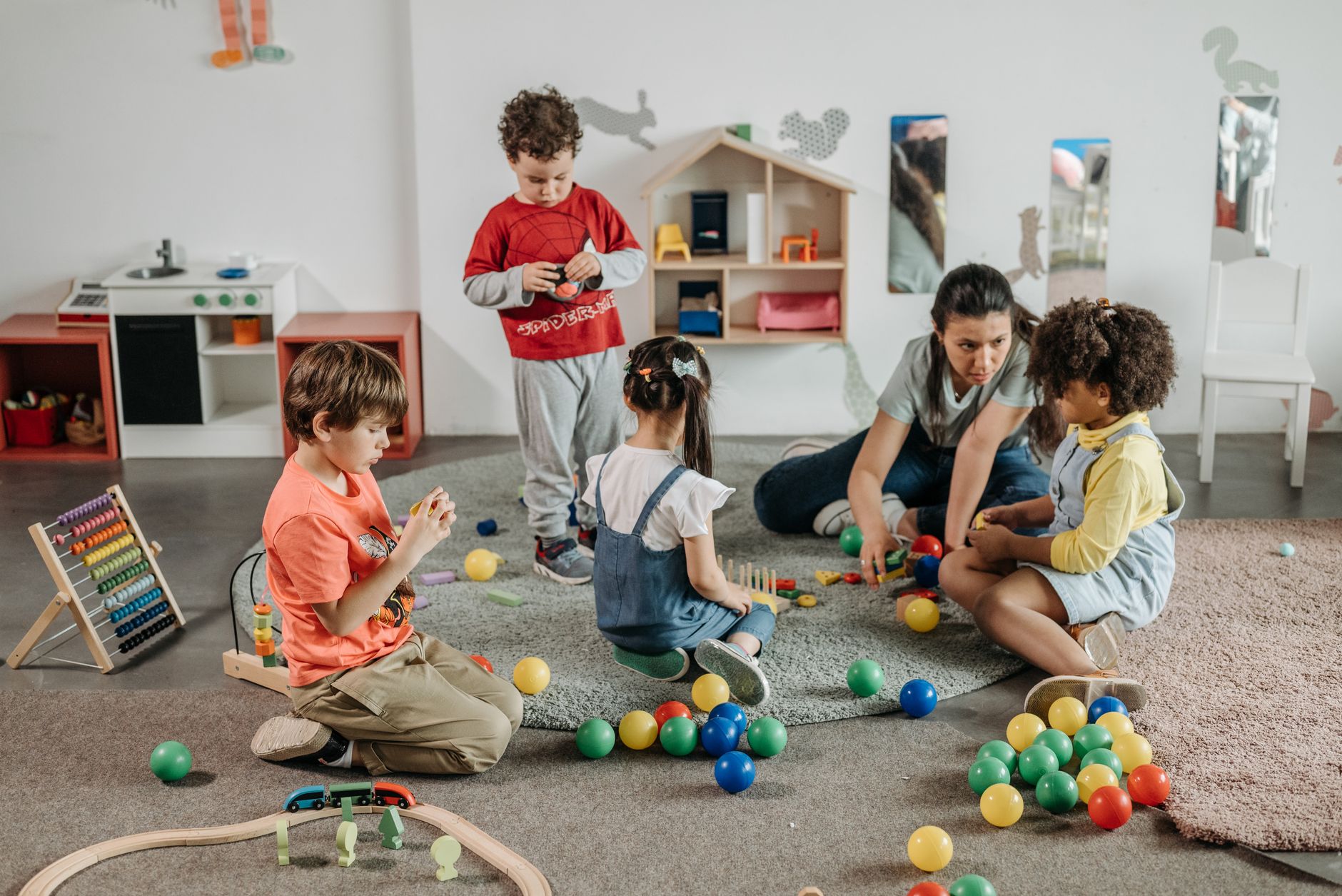 Children learning through play with an adult